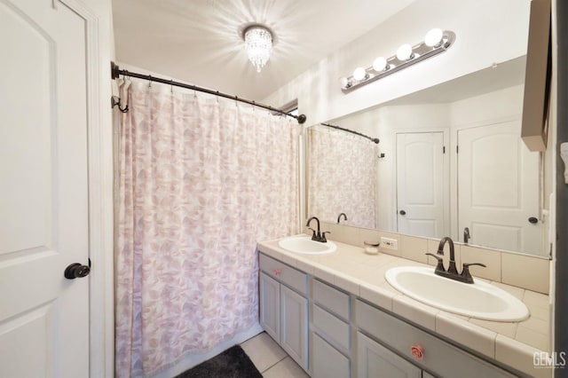 bathroom featuring vanity and tile patterned flooring