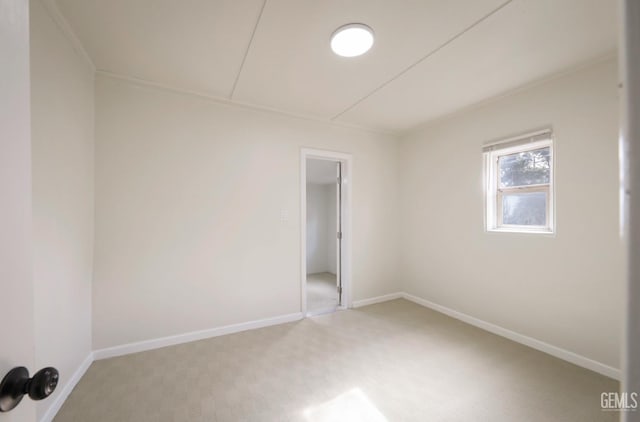 719 Washington Ave, Bakersfield, CA 93308 - unfurnished room with light carpet and baseboards