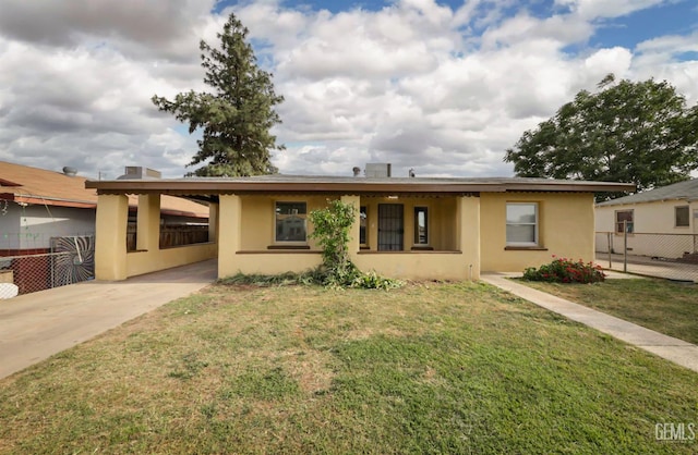 719 Washington Ave, Bakersfield, CA 93308 - ranch-style house featuring stucco siding, a carport, and concrete driveway
