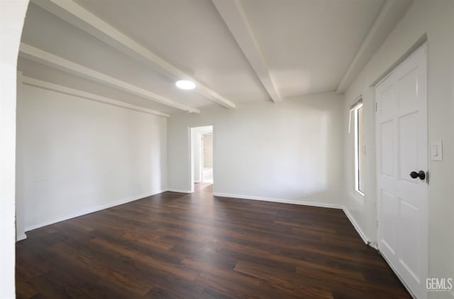 719 Washington Ave, Bakersfield, CA 93308 - empty room featuring beamed ceiling, dark wood-style flooring, and baseboards