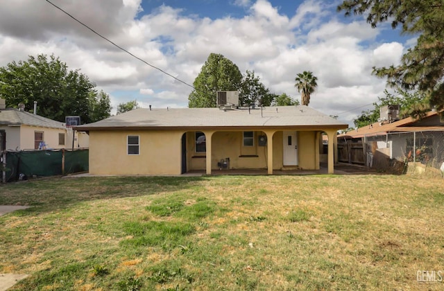 719 Washington Ave, Bakersfield, CA 93308 - rear view of house with cooling unit and stucco siding