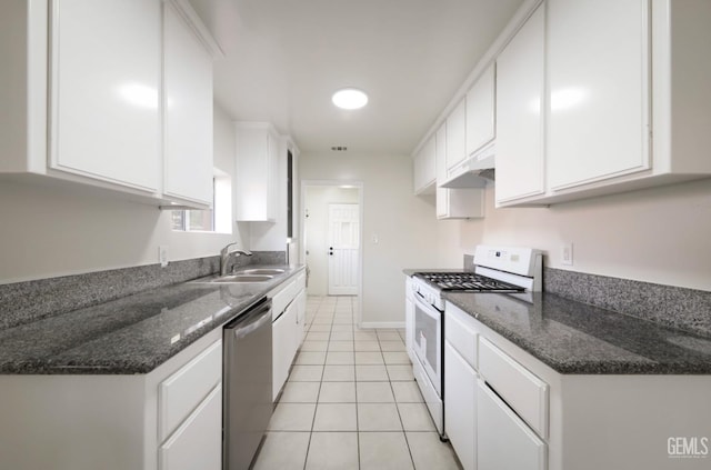 719 Washington Ave, Bakersfield, CA 93308 - kitchen featuring white range with gas stovetop, dishwasher, a sink, white cabinets, and light tile patterned floors
