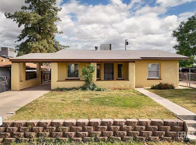 719 Washington Ave, Bakersfield, CA 93308 - ranch-style house featuring a carport, stucco siding, concrete driveway, and central air condition unit