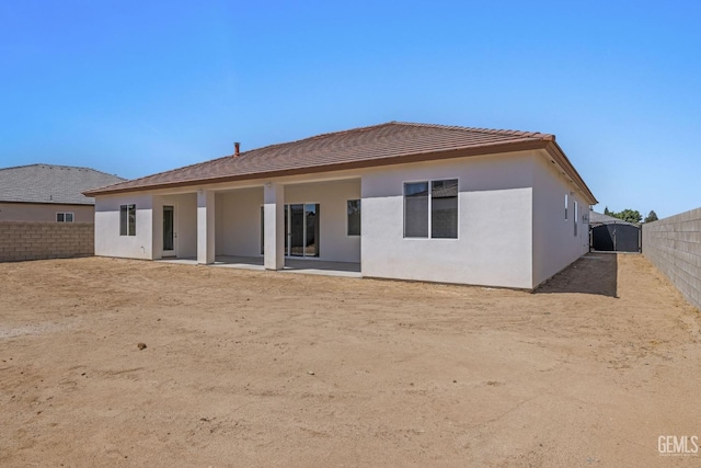 back of property with a patio area