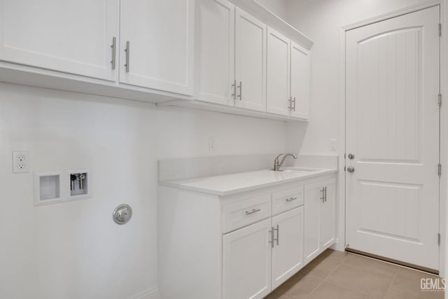 laundry area featuring sink, cabinets, washer hookup, light tile patterned floors, and electric dryer hookup