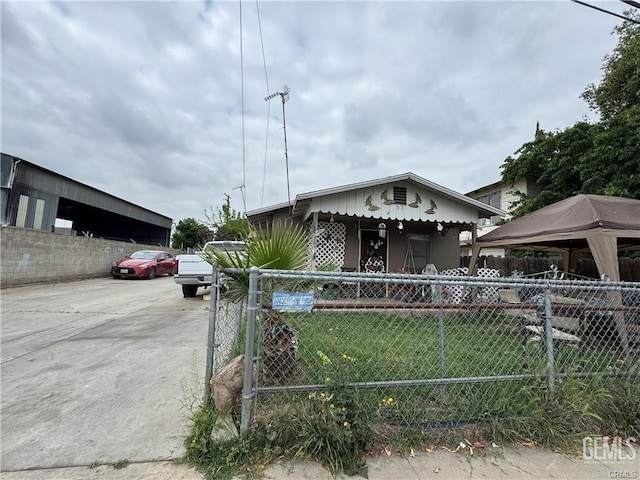 bungalow-style house with a fenced front yard