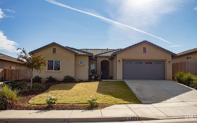 view of front of home with a garage and a front yard