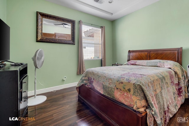 bedroom featuring dark hardwood / wood-style flooring