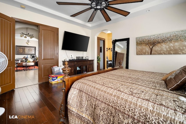 bedroom featuring dark hardwood / wood-style flooring and ceiling fan