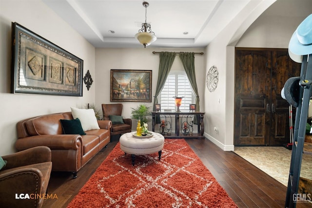 living room with dark hardwood / wood-style flooring