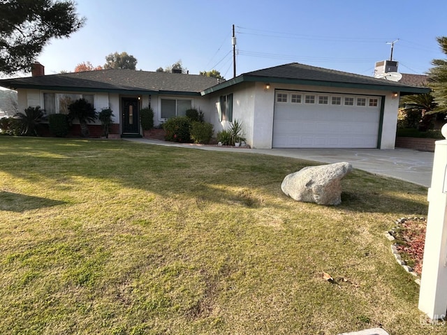 single story home with a garage and a front lawn