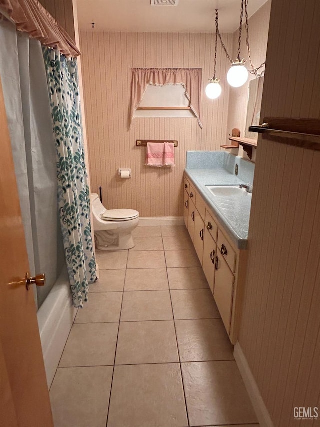 full bathroom with tile patterned floors, vanity, toilet, and shower / bath combo