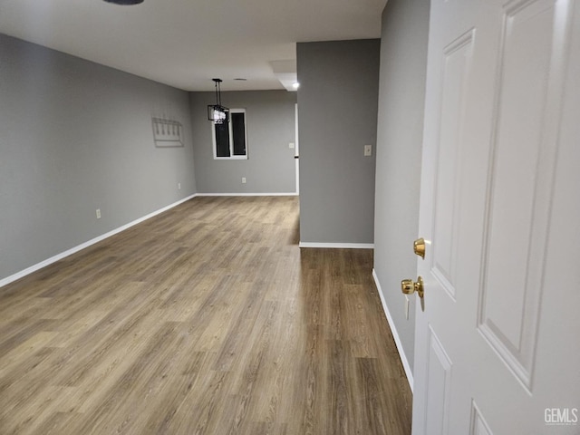 spare room with wood-type flooring