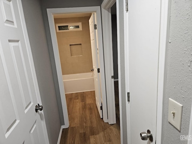 hallway featuring hardwood / wood-style floors