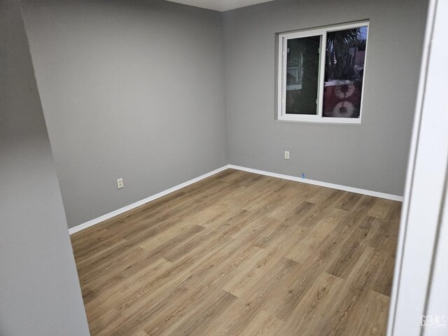 unfurnished dining area with wood-type flooring