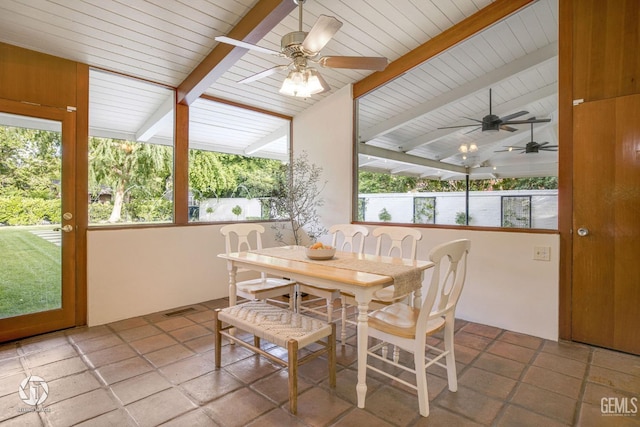 sunroom with ceiling fan and lofted ceiling with beams