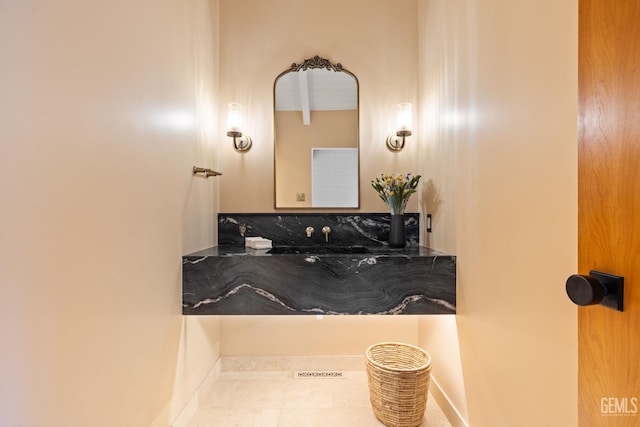 bathroom with tile patterned floors