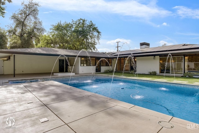 view of swimming pool featuring a patio area and pool water feature