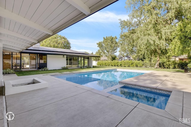 view of swimming pool with a patio area and an in ground hot tub