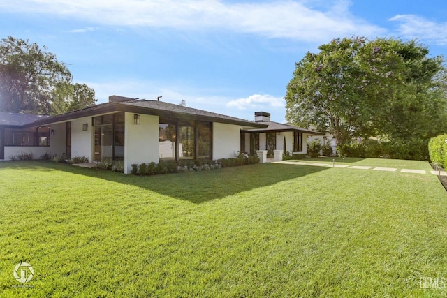 exterior space with a front lawn