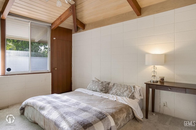 carpeted bedroom with vaulted ceiling with beams and wooden ceiling