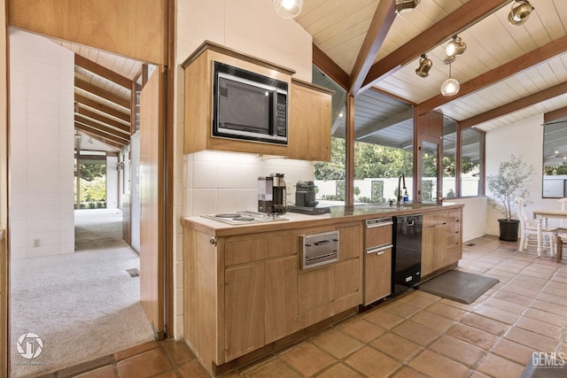 kitchen with black appliances, vaulted ceiling with beams, sink, and light carpet