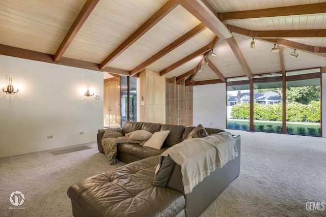 carpeted living room with beamed ceiling and high vaulted ceiling