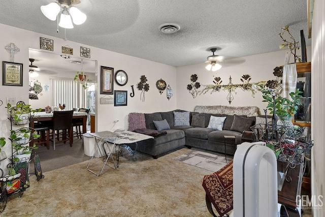 800 Lexington St Unit 28, Delano, CA 93215 - living room featuring ceiling fan, carpet floors, and a textured ceiling