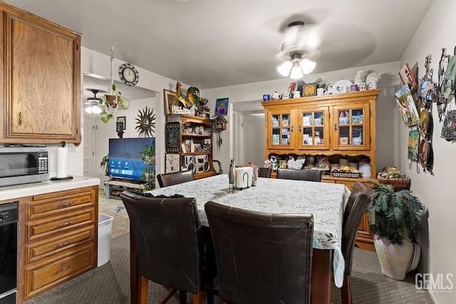 800 Lexington St Unit 28, Delano, CA 93215 - dining area with dark colored carpet and ceiling fan