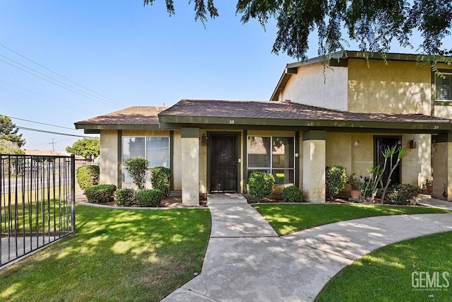 800 Lexington St Unit 28, Delano, CA 93215 - view of front of house with stucco siding and roof with shingles