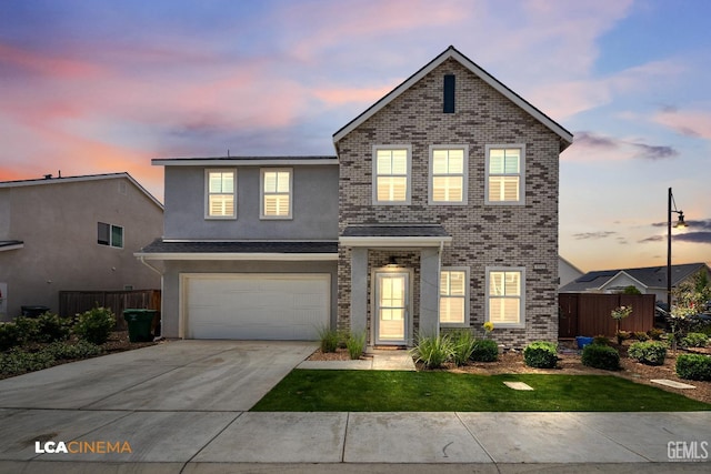 3303 Rustic Woods Ln, Shafter, CA 93263 - traditional-style house with driveway, a garage, brick siding, and stucco siding