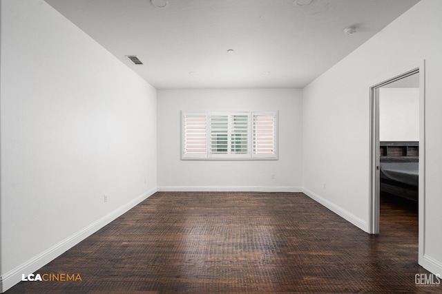 3303 Rustic Woods Ln, Shafter, CA 93263 - spare room featuring baseboards, wood finished floors, and a smoke detector