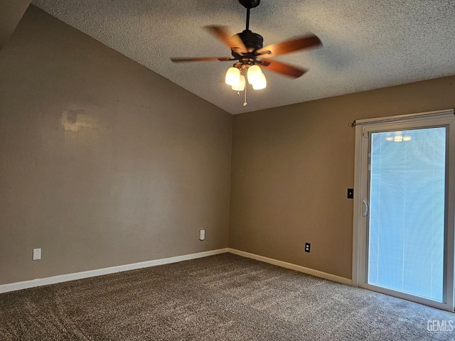 unfurnished room featuring ceiling fan, vaulted ceiling, carpet floors, and a textured ceiling