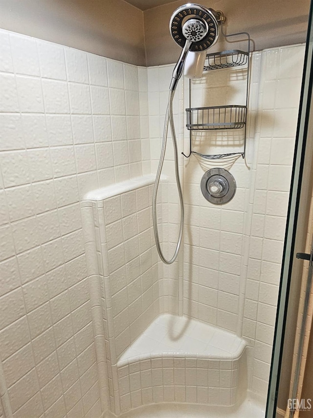 bathroom with a tile shower