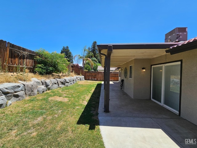 view of yard with a patio area and central AC unit