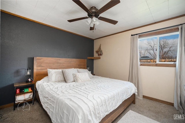 carpeted bedroom with ceiling fan and crown molding