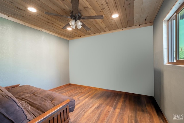 empty room with hardwood / wood-style flooring, ceiling fan, and wooden ceiling