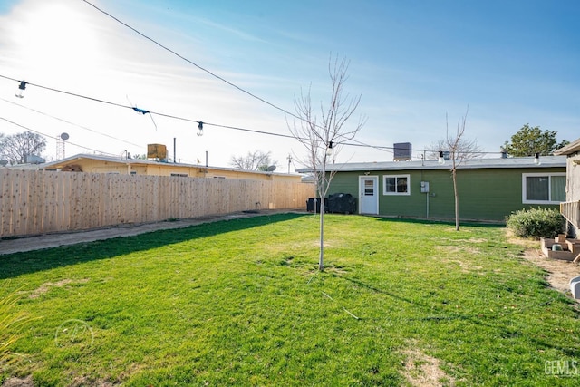 view of yard featuring central AC unit