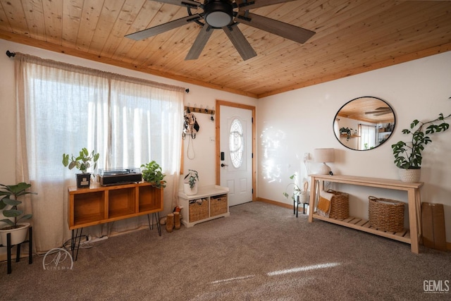 entrance foyer featuring carpet flooring, ceiling fan, and wooden ceiling