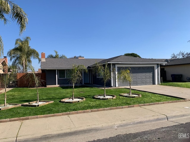 single story home featuring a garage and a front yard