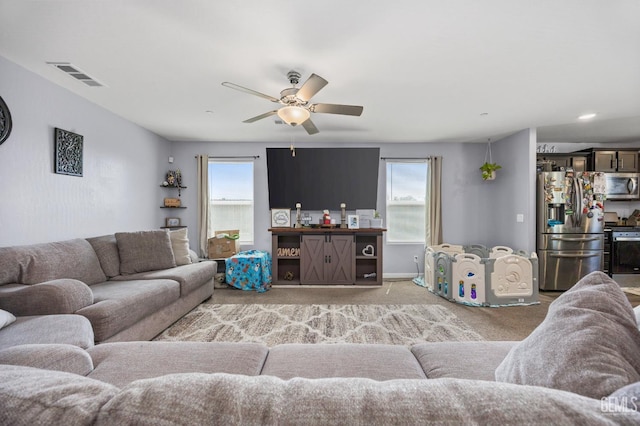 5803 Vespucci Ave, Bakersfield, CA 93313 - living room featuring a ceiling fan and light colored carpet