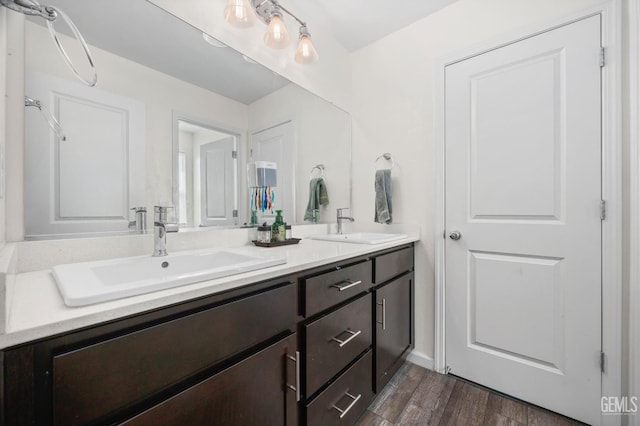 5803 Vespucci Ave, Bakersfield, CA 93313 - bathroom with double vanity and wood finished floors