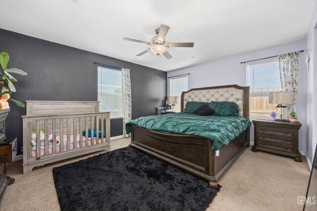 5803 Vespucci Ave, Bakersfield, CA 93313 - bedroom featuring multiple windows, carpet, and a ceiling fan