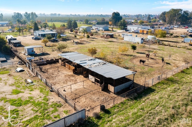 birds eye view of property with a rural view