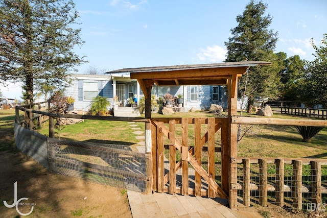 view of front of house featuring a front lawn and a fenced front yard