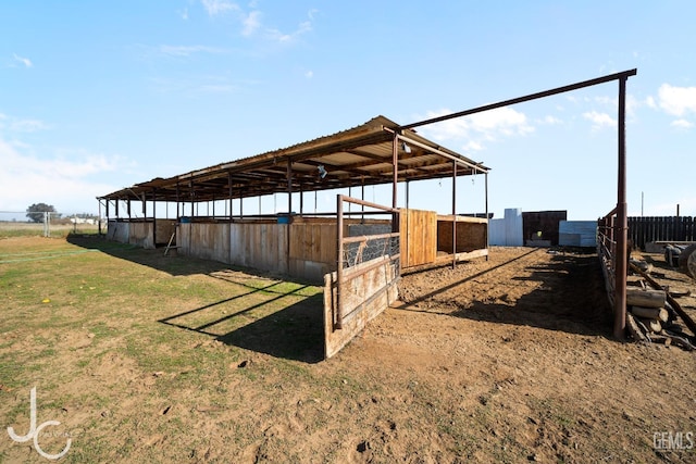 view of yard with an outdoor structure and an exterior structure