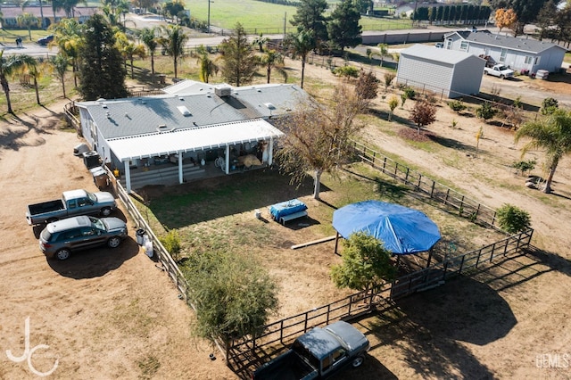 birds eye view of property featuring a rural view