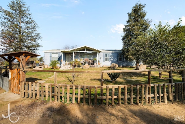 view of front of property with fence and a front yard