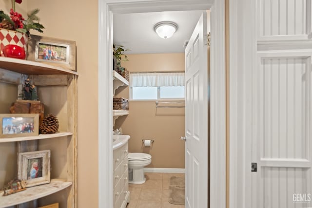 bathroom with tile patterned floors and toilet