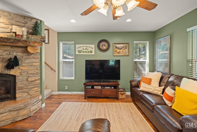 living room with hardwood / wood-style floors and ceiling fan